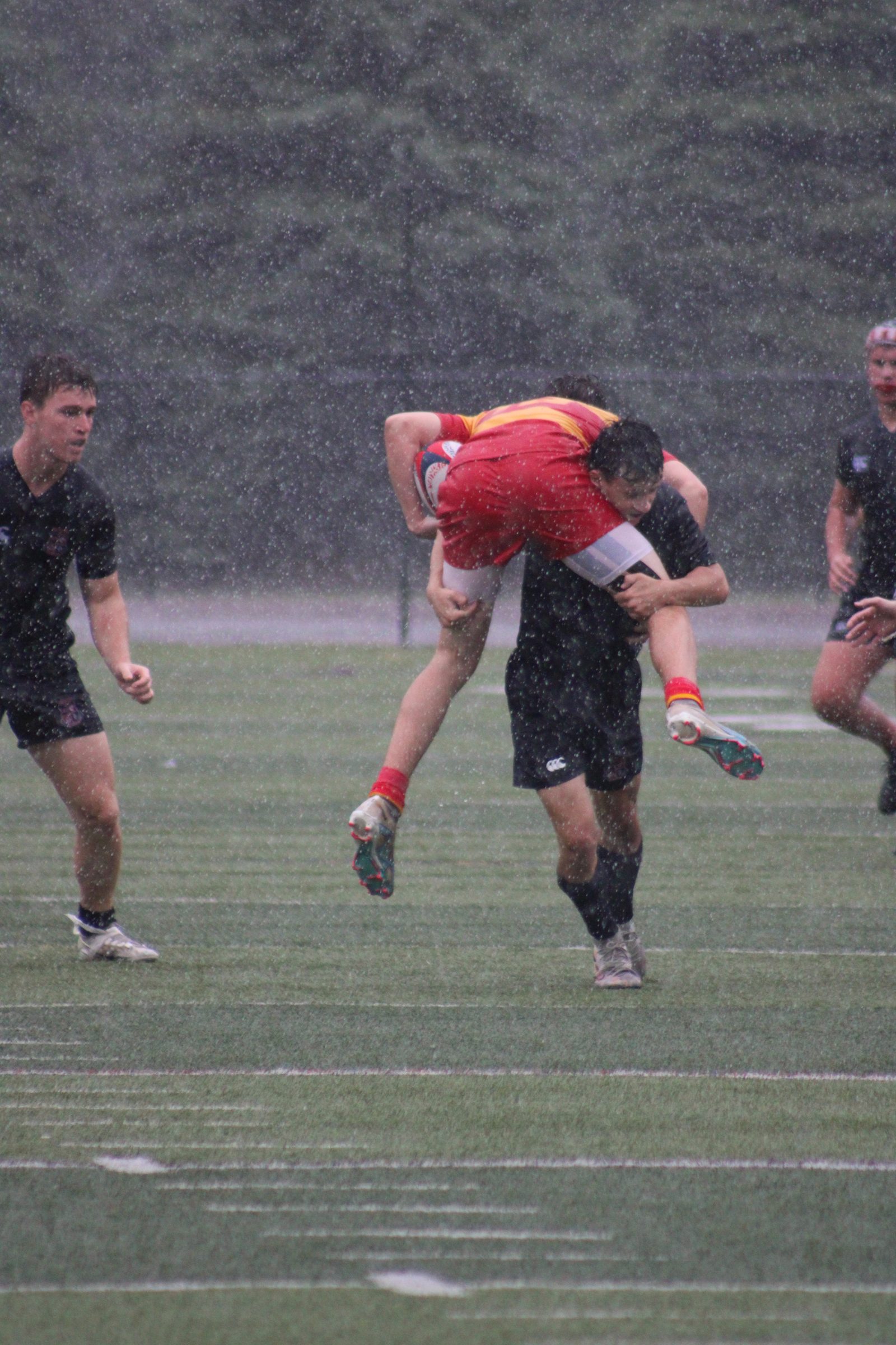 Lifted in the tackle, rain hammering down
